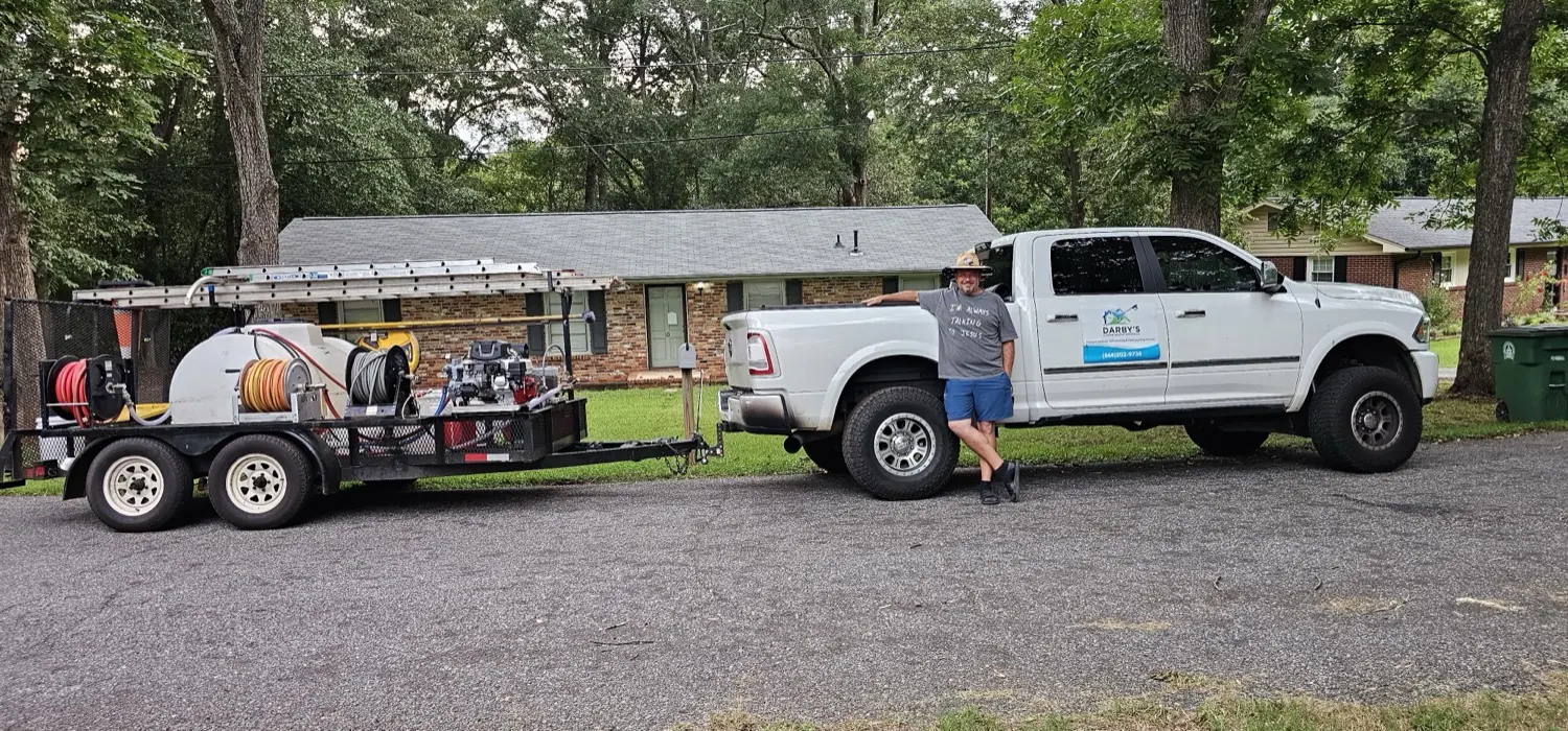 Tim Darby with his truck and equipment trailer